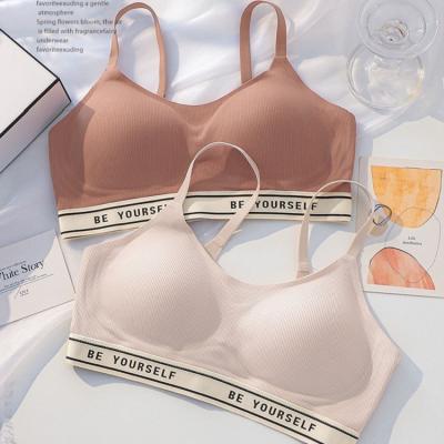 China New breathable high quality letter ribbed wire simple one-piece custom logo seamless lift up comfortable slim sleep cup bra for sale