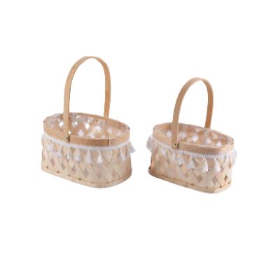 China Viable Widely Used Woven Wicker Basket Flower Food Storage Basket Empty Weave Handle Picnic Basket Breadfruit Willow Basket for sale