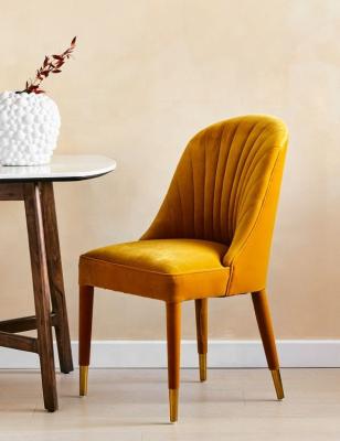 China Modern Design Light Luxury Italian Style Orange Use Velvet Fabric Dining Chairs for sale