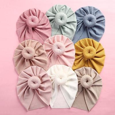 China Cute Baby Hair Ornament Knot Turban Cotton Donut Photography Newborn Headband Elastic Knitted Infant Hat for sale