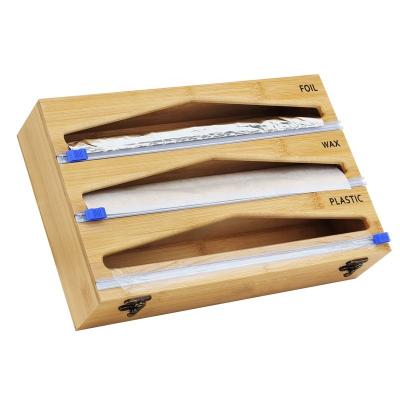 China Sustainable bamboo 3 in 1 wrap dispenser with cutter, wrap, plastic foil and wax paper dispenser for kitchen for sale