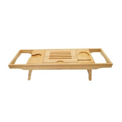 China Sustainable Folding Bamboo Bathtub Tray Wooden Bamboo Bathcaddy With Extendable Legs for sale