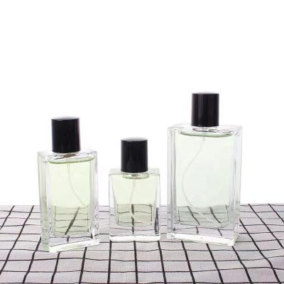 China Unique Custom Clear Glass Bottle 50ml 100ml Spray Empty Perfume Bottle With Spray Pump Cap for sale