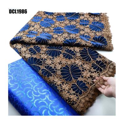 China Wholesale price Double color African cord guipure lace embroidery fabric with stones wedding dress Nigerian women clothings for sale