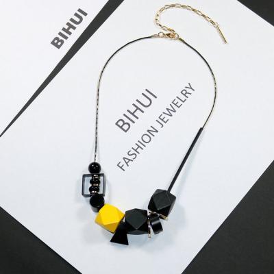 China Unique Designer Style Fashion Necklace Quality Plated Geometric Wooden Beads Triangle Charm Beads Brass Findings Gold Sharpening Chain Punk for sale