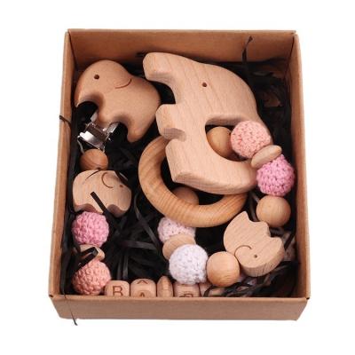 China Soft Toy Customized Newborn Baby Wood Teether Gift Set Pacifier Chain Hook Seed Bead Wooden Teething Bracelet Gift Set for sale