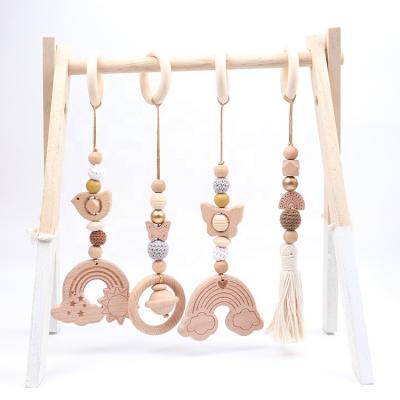 China Musical Accessories Newborn Stroller Fitness Pendants Teething Toys Hanging Ring Custom Baby Play Gym for sale