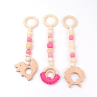 China Quality Assurance New Musical Baby Game Sets Hanging Gym Activity Wooden Teething Toys For Baby Gym for sale