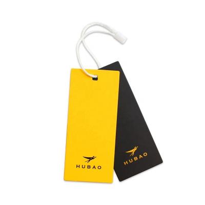 China Sustainable Swing Tag Factory Customizes Paper Hang Tag With Silver Debossed Logo For Clothing for sale