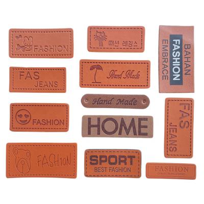 China Sustainable Garment Accessories DIY Crafts PU Leather Patches , Custom Jeans Bags Shoes Embossed Leather Tag Hat Brown Labels for sale