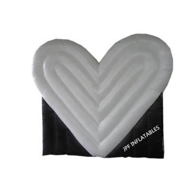 China 2022 Custom Black and White PVC 0.4mm Tarpaulin New Arrival Heart Shape Inflatable Dome Tent Canopy With 2 Doors for sale