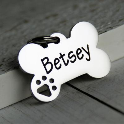 China Custom Fashion Stainless Steel Metal Dog Tags Beautiful Dog Footprint Bear Print Bone Shaped Pendant Charm Engraved Tag for sale