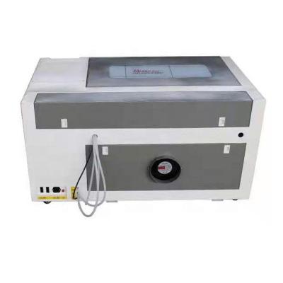 Cina Co2 4060 6090 1390 1610 1325 laser engraving machine for metal and nonmetal wood in vendita