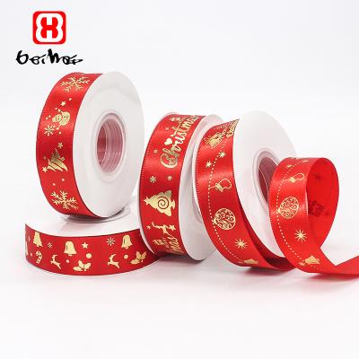 China Bei factory high tenacity hot sale 1 inch hai gold foil printed Christmas tree deer Santa Claus Snowman Satin Christmas Ribbon for wrapping for sale