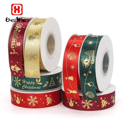 China Factory Wholesale Retail High Tenacity New Foil Gold Printed Christmas Tree Deer Santa Claus Snowman Polyester Satin Christmas Ribbon For Wrapping for sale