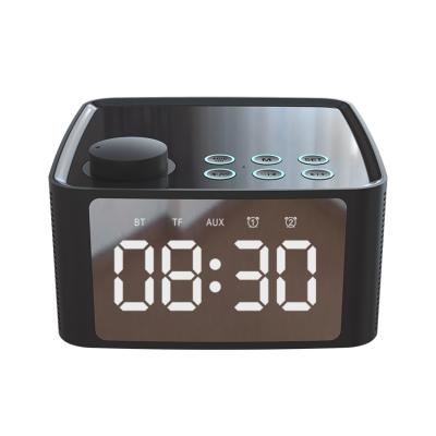 China Radio 2020 Hot Selling Portable 3 in 1 Wireless Mini Radio BT 5.0 Alarm Clock Speaker with Cell Phone Holder for sale