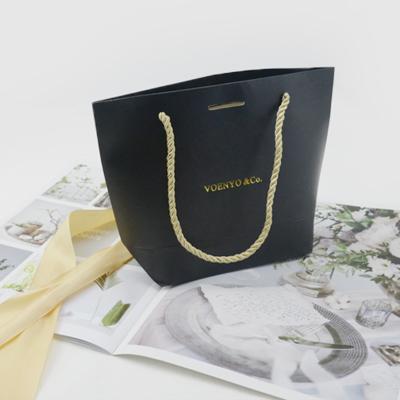 China golssy handmade black gold stamping lamination ribbon gift bag jewelry packaging custom logo paper bag for jewelry for sale