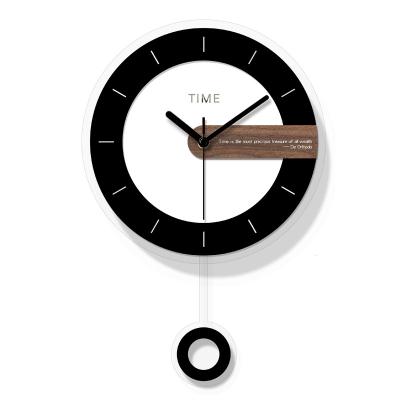 China Round Acrylic BREF Modern Black And White With Swinging School Office Decoration Creative Home Wall Clock for sale