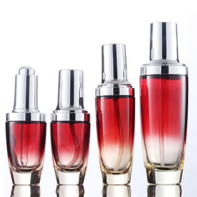 China PERFUME Packaging 30ml 50ml100ml High End Cosmetic Glass Gradient Spray Bottle Skin Care Use Red Color With Gold UV Pump for sale