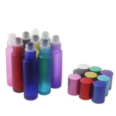 China Personal Care 10ml Colored Frosted Glass Roll On Bottles With Gemstone Roller for sale