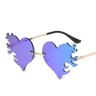 China Custom Heart-Shaped Glasses Fashion Sunglasses Hot Sale Logo Fashion Rimless Frameless Love Fancy Party Glass Ladies Accessories for sale