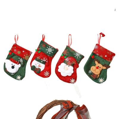 China Green Cloth Buy 50pcs Stocking Items Christmas Snowman Socks Arming Stringing Stockings Fabric Drop Shipping 50pcs for sale