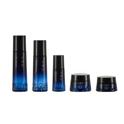 China 2022 New Cosmetics Glass High End Bottle Set Luxury Black Empty Glass Round Jar Skin Care Bottle Customized Set for sale