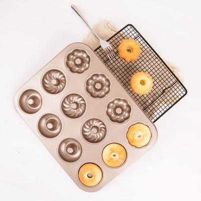 China 12 Cavity Carbon Steel Sitck Fluted Mold Non Sustainable For Donut Cake Bagel Donut With 3patterns for sale