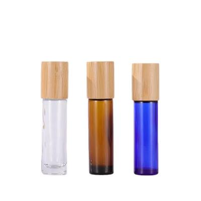 China Wholesale 10ml Cosmetic Amber Blue Roll On Glass Bottle With Bamboo Cap for sale