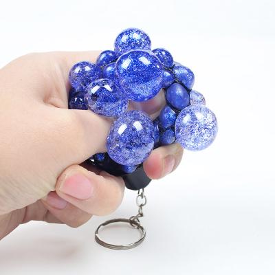 China Stress Release TPR Key Chain Stress Net Squeeze Toy For Adults And Children With Decompression Artifact Decompression Toy Grape Squeeze Ball for sale