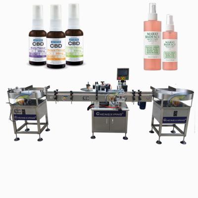 China Food spray automatic bottle labeling machine 30ml 50ml 180ml, round bottle labeling machine for sale