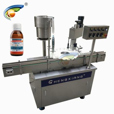 China Food GMP Standard Square Bottle Metal Screw Cap Sealing Machine for sale