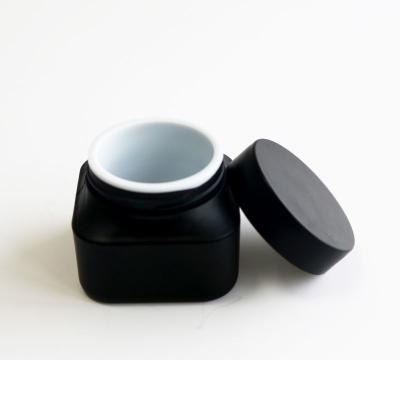 China Hot Selling Black Cosmetic Jar 50g PP Container Household Products Empty Plastic Face Cream Jar Container For Butter And Body Cream for sale