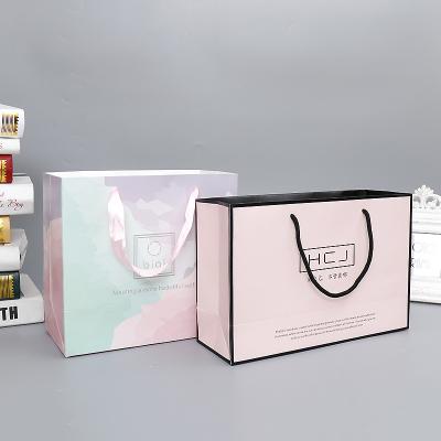 China Recycled Materials Customized Handle Bag Jewelry Perfume Gift Bag Cupcake Shoe Packaging Bag Cheap Wholesale Packaging Paper With Bow Knot for sale