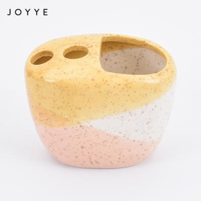 China Sustainable Daily Home Use Gloss Ceramic Accessories Joyye Colorful Toothpaste Holder Custom Colorful Bath Toothbrush and Brush Toothpaste Holder for sale