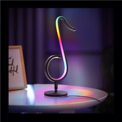 China Modern Warm Sale Musical Note Lamp RGB Symphony Table Lamp Bedside Living Room Bedroom Wall Lamp Night Light for sale