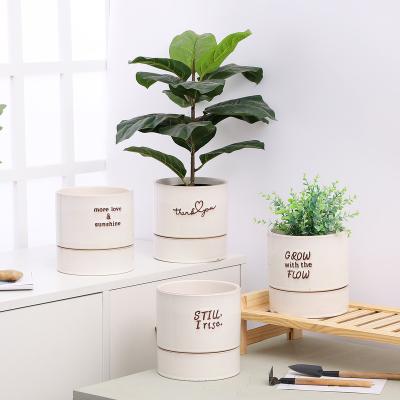 China Nordic Minimalist Simple Ceramic Flower Pots and Planters Round Garden Plant Pots with Word for Indoor Outdoor Decoration for sale