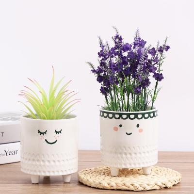 China Beautiful Minimalist Creative Ceramic Succulent Footed Plant Flower Pot Planter Pot Small Human Face Plant Pot for sale