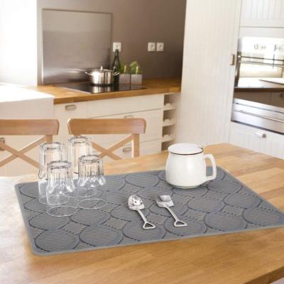 China Viable Custom Design 100% Food Grade Non-slip Silicone Table Mat Heat Resistant Plates Drying Mat for sale