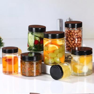 China Refillable Empty Food Storage Container Candy Jelly Glass Honey Jar With Tin Lid for sale