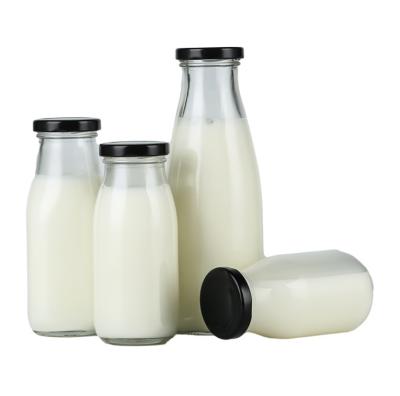 China Milk factory sale juice bottles glass clear glass milk bottle with metal lid for sale