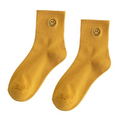 China Disposable Fashion Solid Color Face Pattern Cotton Women High Quality Smile Socks for sale