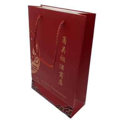 China Recycled Materials Wholesales Custom Logo Printed Kraft Paper Bags With Twisted Flat Handles Custom Handles for sale