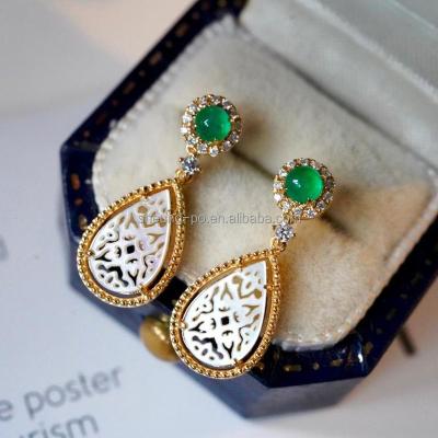 China CLASSIC Hollow Classic Pattern White Shell Natural Emerald Dangle Earrings Jewelry in 18k Real Gold for Women Girl Gift for sale