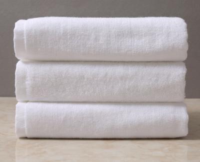 China Compressed Hotel Embroidery Logo White 21S Cotton Sauna Shower Beauty Shop 100% Soft Spa Bath Towel for sale