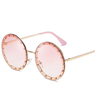 China Trendy Sunglasses Round Frame Eyewear Women Diamond Luxury Metal Sun Shades Frameless Sunglasses for sale