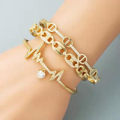 China FASHIONABLE Creative Nose Bracelet Heart Geometry Pig Geometry ECG Personality Gold Zircon Female Copper Plated Micro Set Bracelet for sale