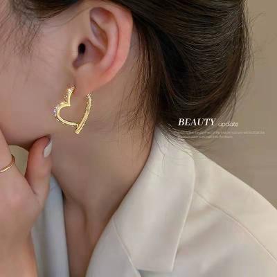 China CLASSIC real gold plated needle zircon heart silver earrings light up niche temperament luxury earrings for sale