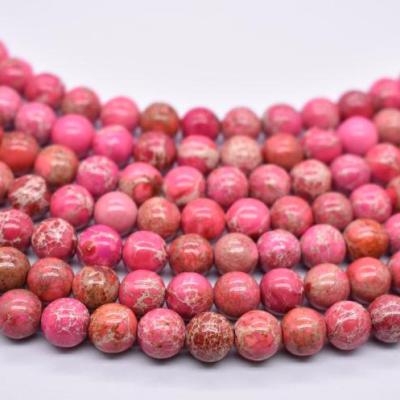 China Charming Trendy Natural Smooth Gemstone Jasper Pink Color Sea Sediment Imperial Round Round Loose Stone Beads for sale