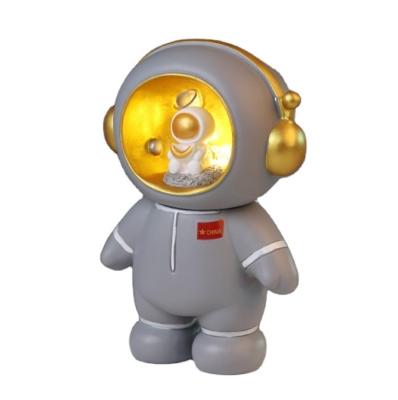 China Competitive Price Ceramic Astronaut Led Light Painting Piggy Bank Custom Astronaut Projector Light for sale